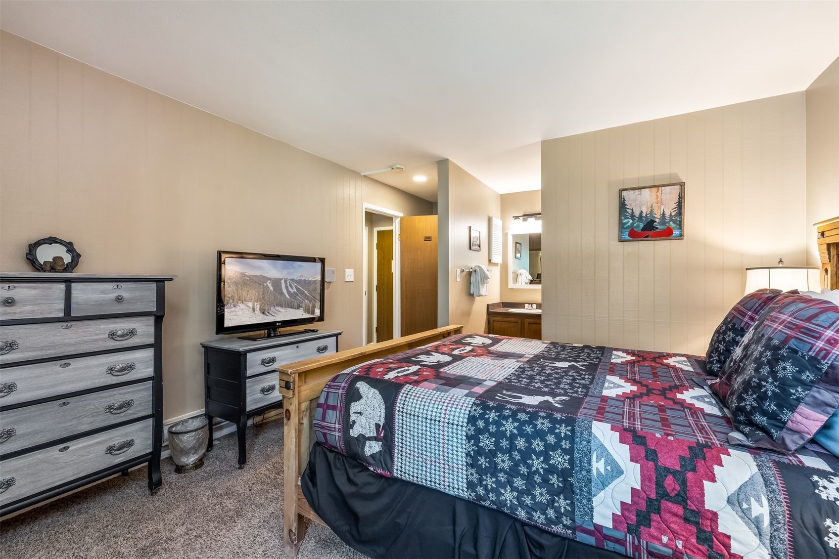 1977 Soda Ridge Road, Unit 1194 Keystone, CO 80435 - Photo 18 of 38 a bedroom with a bed and a flat screen tv