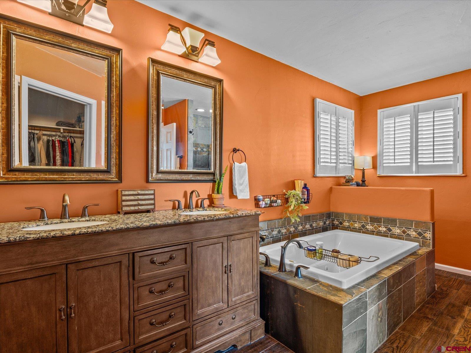 16222 6830th Road Montrose, CO 81401 - Photo 15 of 34 a bathroom with a granite countertop sink and a mirror