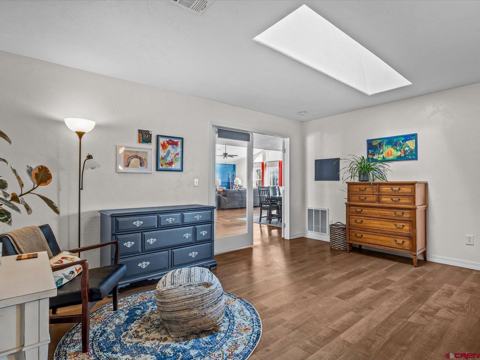 16222 6830th Road Montrose, CO 81401 - Photo 17 of 34 a room with furniture and wooden floor