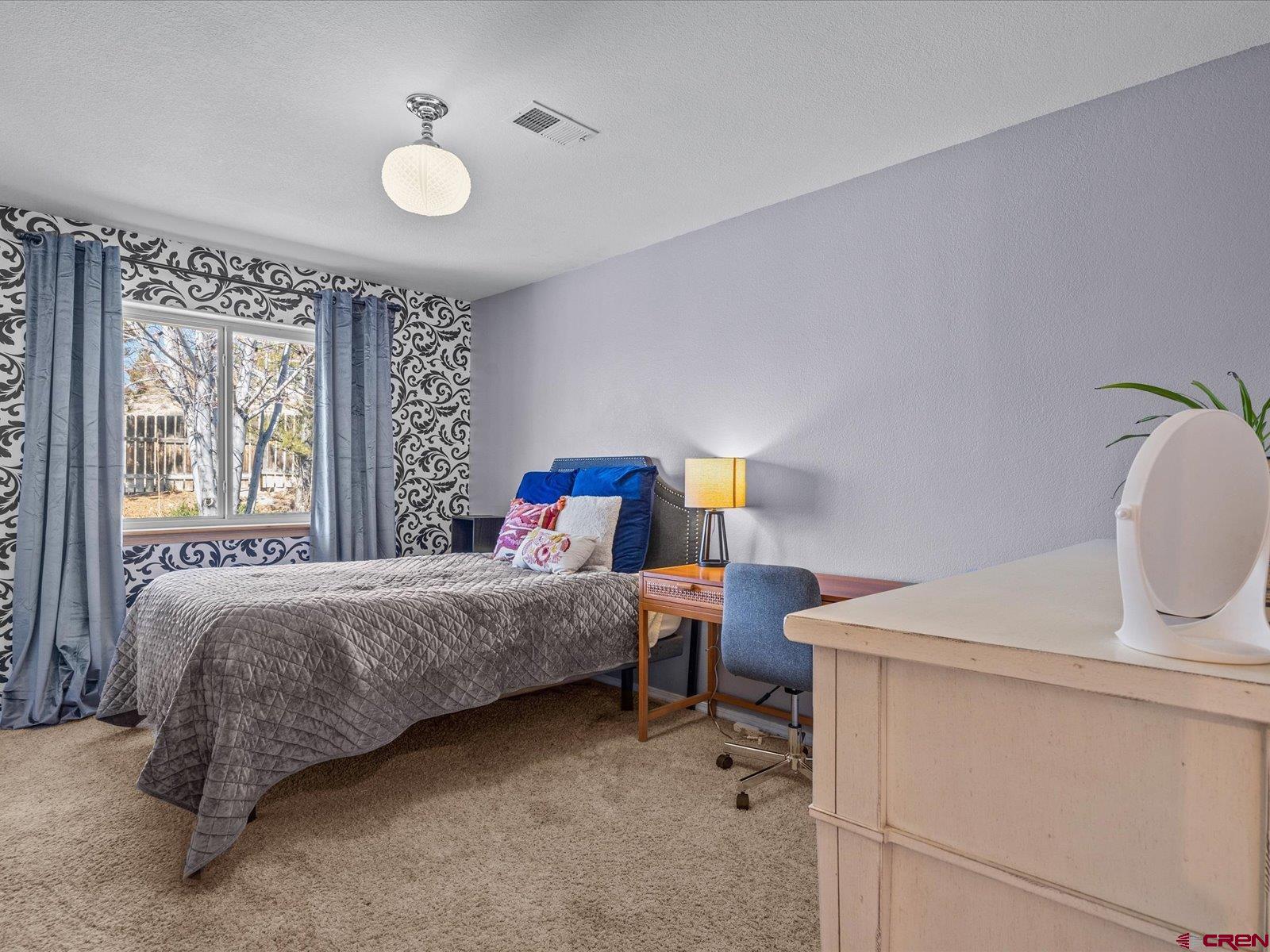 16222 6830th Road Montrose, CO 81401 - Photo 21 of 34 a bedroom with a bed and window