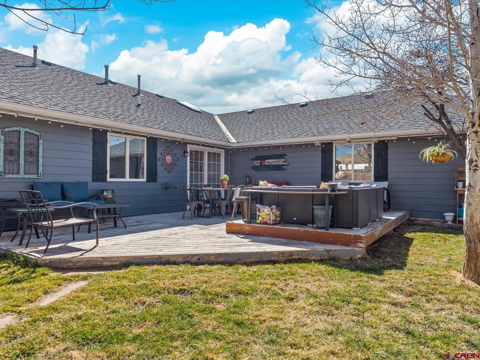16222 6830th Road Montrose, CO 81401 - Photo 26 of 34 a view of a house with swimming pool and sitting area