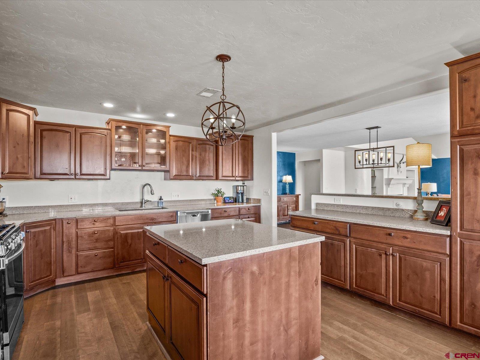 16222 6830th Road Montrose, CO 81401 - Photo 10 of 34 a kitchen with stainless steel appliances a sink stove and cabinets