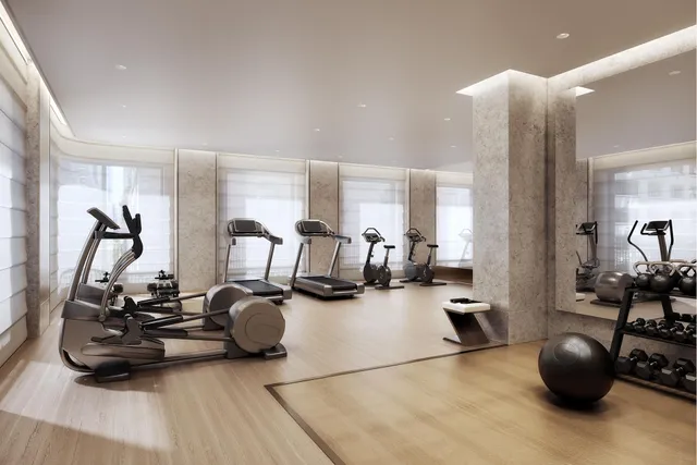 a living room with furniture and large windows