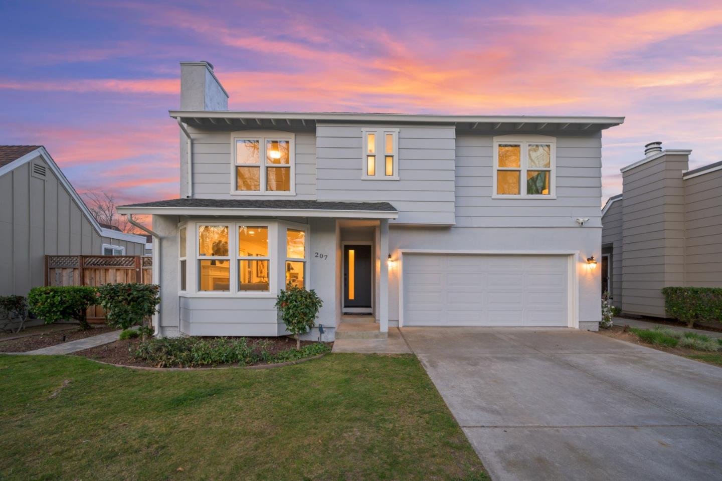 207 Post Street Mountain View, CA 94040 - Photo 1 of 60 a front view of a house with a yard and garage
