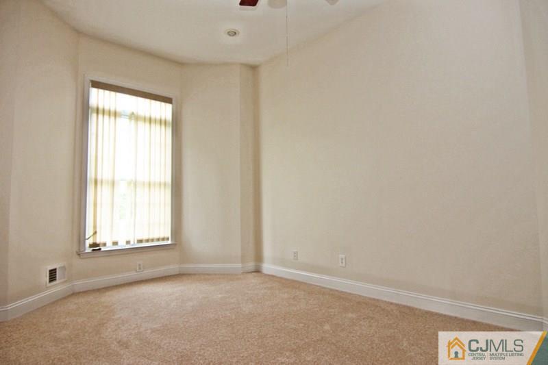 238 Fresh Ponds Road Monroe Township, NJ 08831 - Photo 14 of 17 an empty room with a window