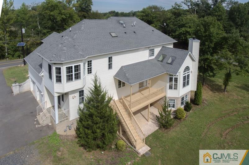 238 Fresh Ponds Road Monroe Township, NJ 08831 - Photo 16 of 17 an aerial view of a house with a yard