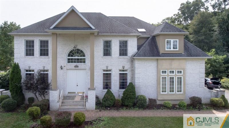 238 Fresh Ponds Road Monroe Township, NJ 08831 - Photo 17 of 17 a front view of a house with garden