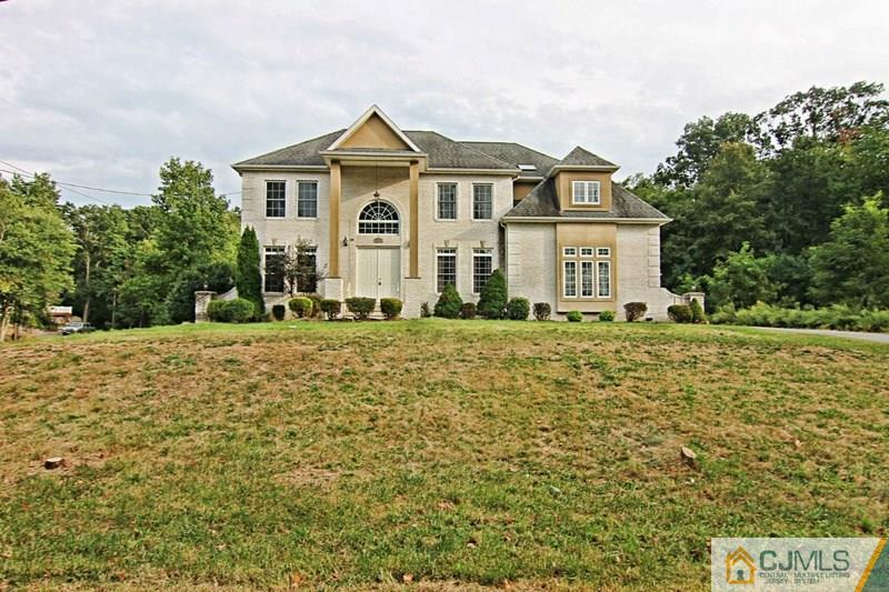 238 Fresh Ponds Road Monroe Township, NJ 08831 - Photo 4 of 17 a front view of a house with a yard