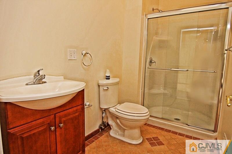238 Fresh Ponds Road Monroe Township, NJ 08831 - Photo 7 of 17 a bathroom with a sink toilet and shower