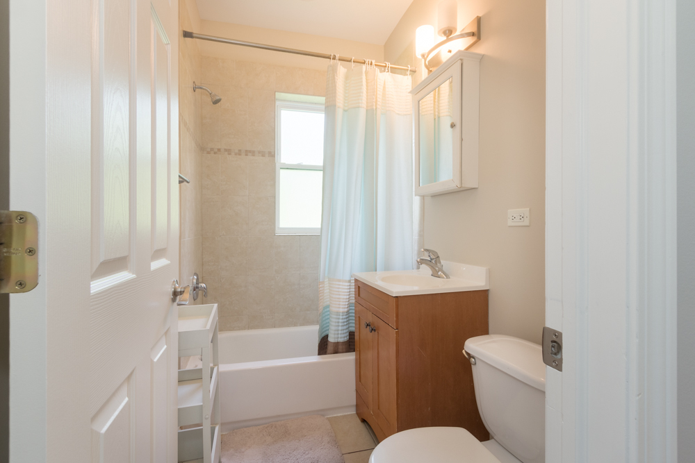 54 Forest Avenue, Unit 3W Riverside, IL 60546 - Photo 6 of 6 a bathroom with a sink a toilet and shower
