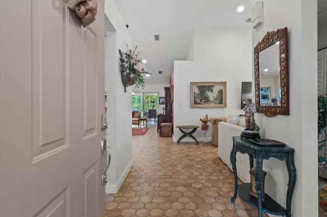a living room with furniture and a table