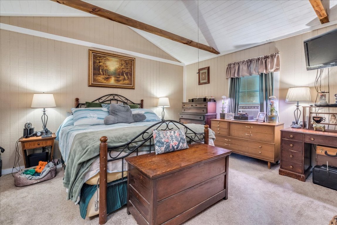 2411 Rohde Road Kyle, TX 78640 - Photo 20 of 40 Bedroom featuring carpet and wooden walls