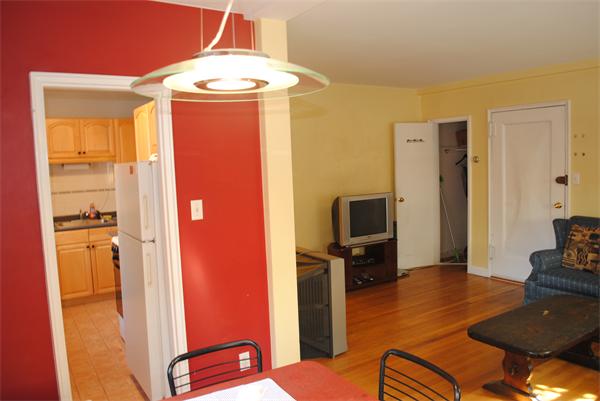 79 Sutherland Road, Unit 1 Boston, MA 02135 - Photo 3 of 10 a living room with furniture and a flat screen tv