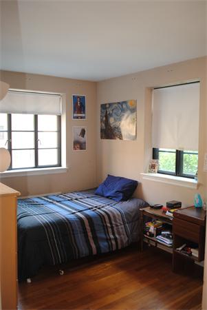 79 Sutherland Road, Unit 1 Boston, MA 02135 - Photo 8 of 10 a bedroom with a bed and a window