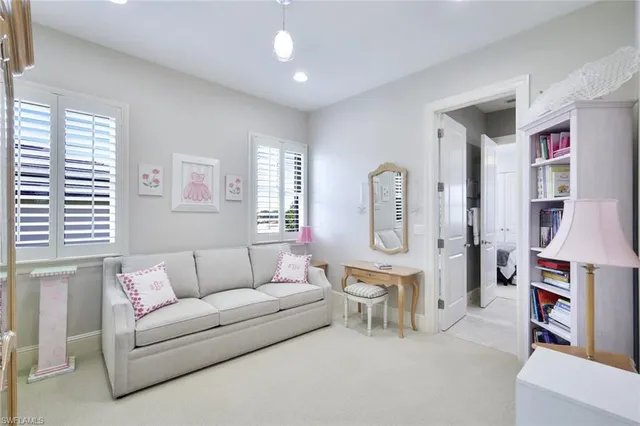 a living room with furniture and a area