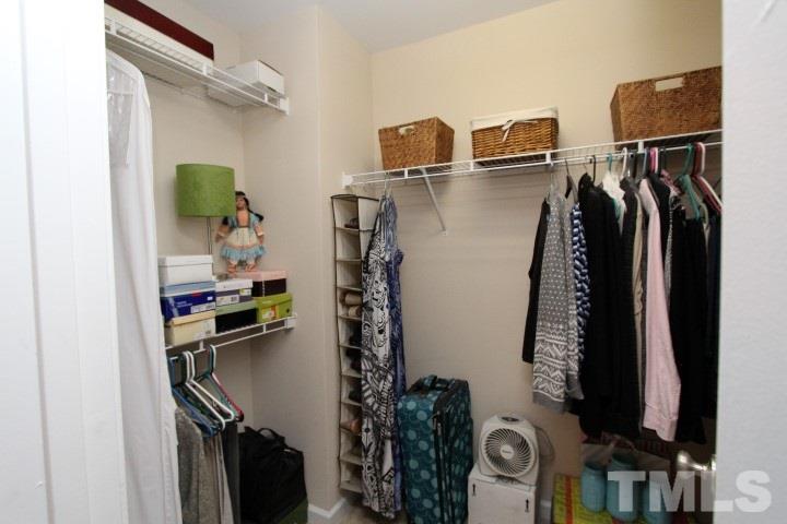 2520 Asher View Court Raleigh, NC 27606 - Photo 22 of 24 Secondary Closet upstairs. Also a large 9x8 walk in unfinished storage on this floor.