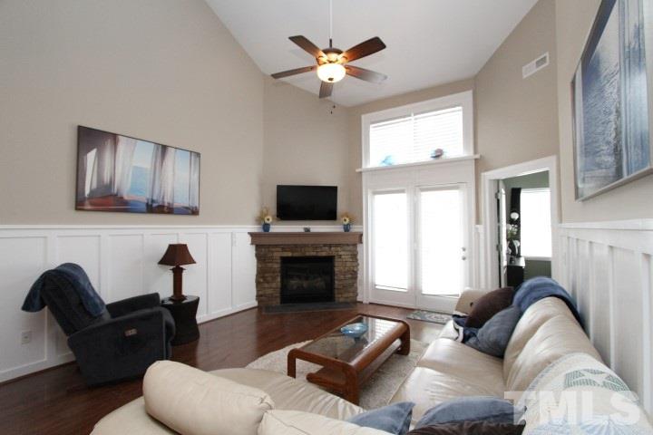 2520 Asher View Court Raleigh, NC 27606 - Photo 5 of 24 Custom Stacked stone and custom mantle with unique pull down mantle front to hide equipment, cords, etc.