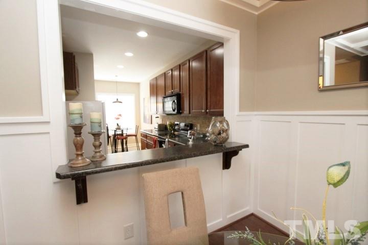 2520 Asher View Court Raleigh, NC 27606 - Photo 7 of 24 Pass thru lowered to gain a better view of each room.