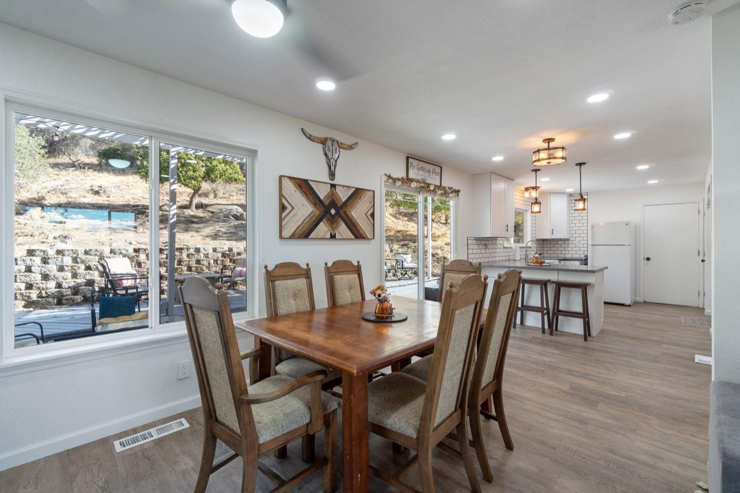 43299 Ranger Cir Drive Coarsegold, CA 93614 - Photo 11 of 44 a view of a dining room with furniture window and wooden floor