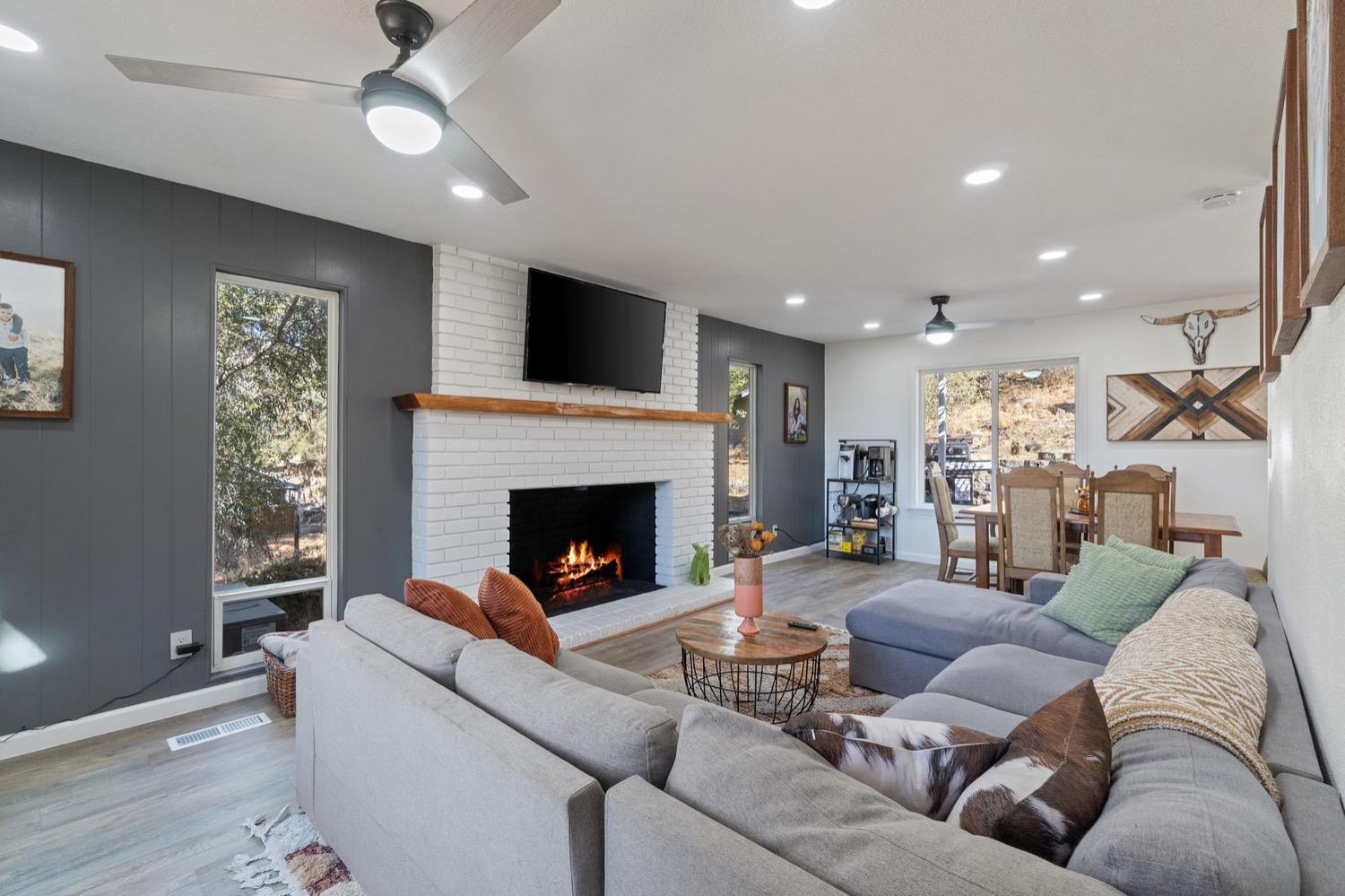 43299 Ranger Cir Drive Coarsegold, CA 93614 - Photo 8 of 44 a living room with furniture and a fireplace
