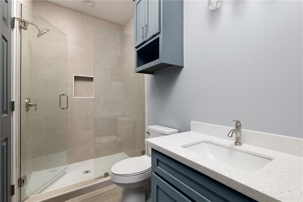 2602 Clearview Street Weslaco, TX 78596 - Photo 9 of 15 a bathroom with a sink toilet and shower
