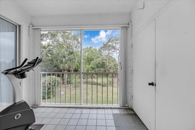 a view of a living room and floor to ceiling window