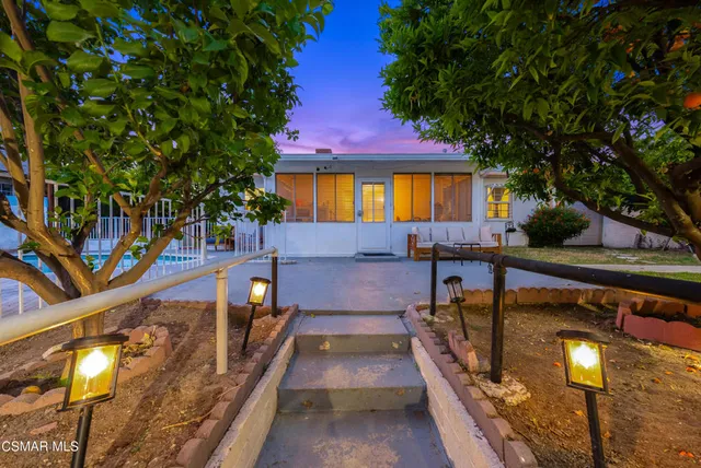 a view of a house with swimming pool