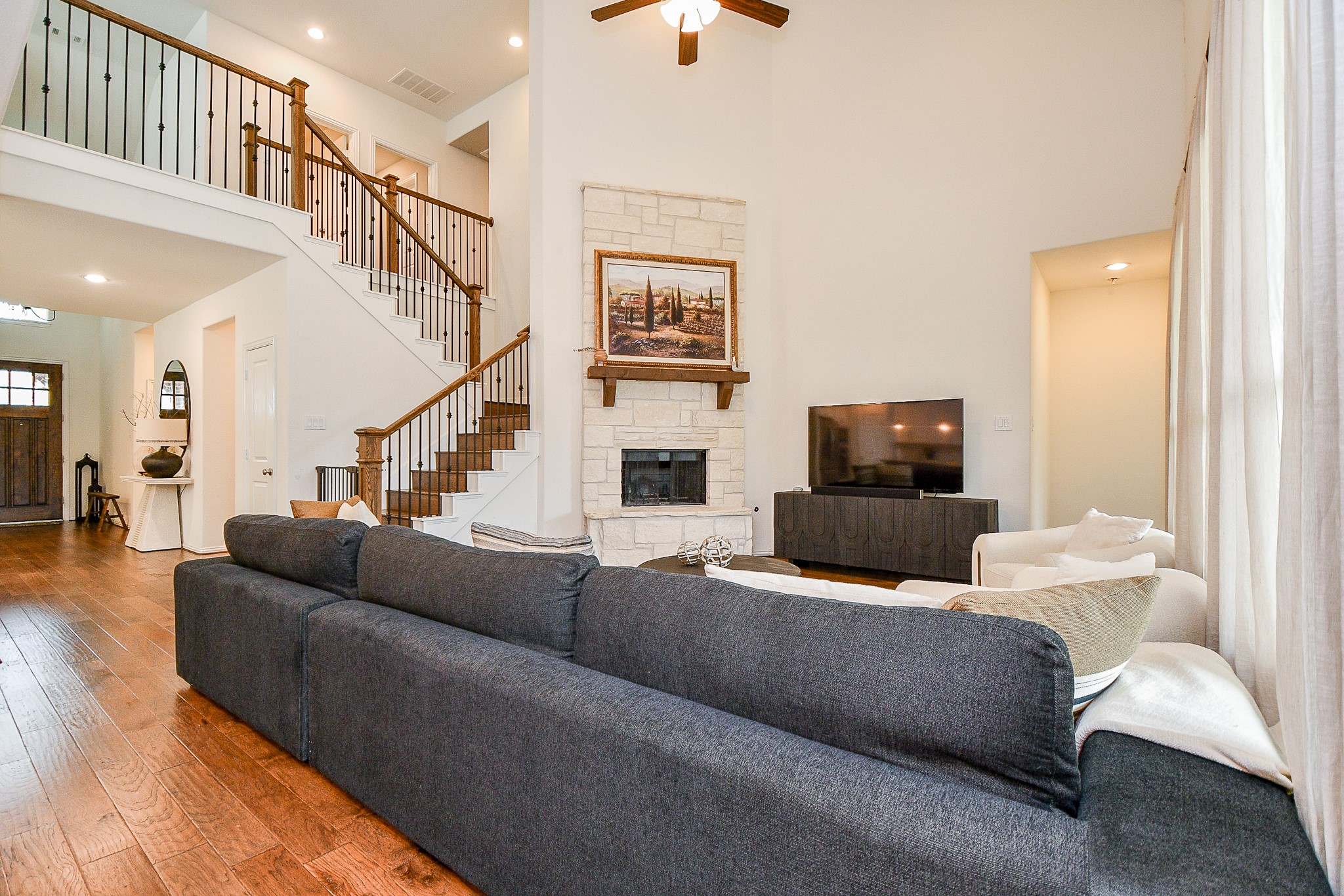 4523 Juniper Ridge Lane Manvel, TX 77578 - Photo 8 of 38 a living room with furniture and a flat screen tv