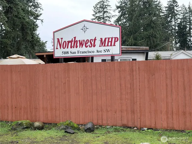 a sign that is on a wooden wall