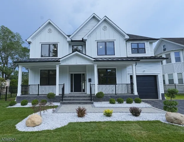 a view of a house with a yard and plants