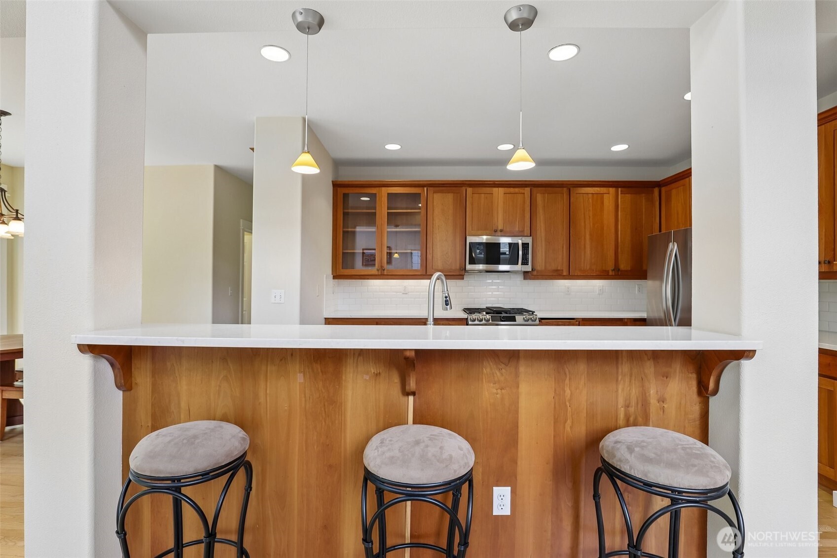 19709 Southeast 26th Way Camas, WA 98607 - Photo 9 of 36 a kitchen with stainless steel appliances granite countertop counter space a sink and chairs