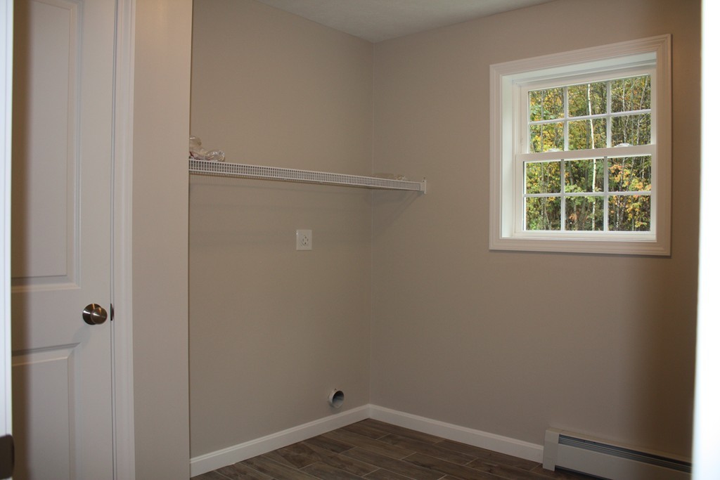 1080 West Road Ashby, MA 01431 - Photo 7 of 10 a view of a small space with wooden floor and a window