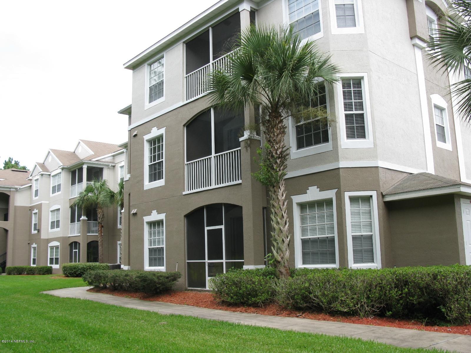10550 Baymeadows Road, Unit 623 Jacksonville, FL 32256 - Photo 1 of 20 a front view of a house with a yard