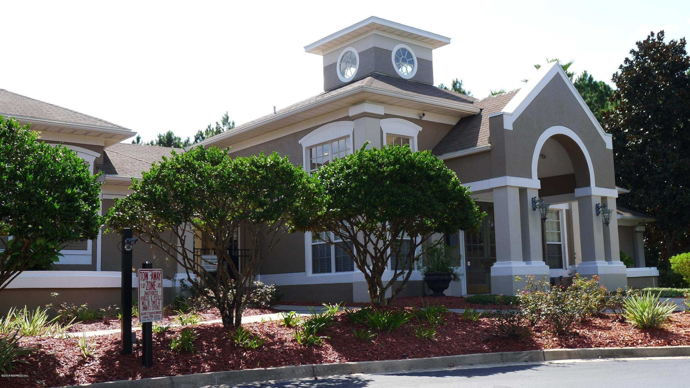 10550 Baymeadows Road, Unit 623 Jacksonville, FL 32256 - Photo 18 of 20 a front view of a house with garden