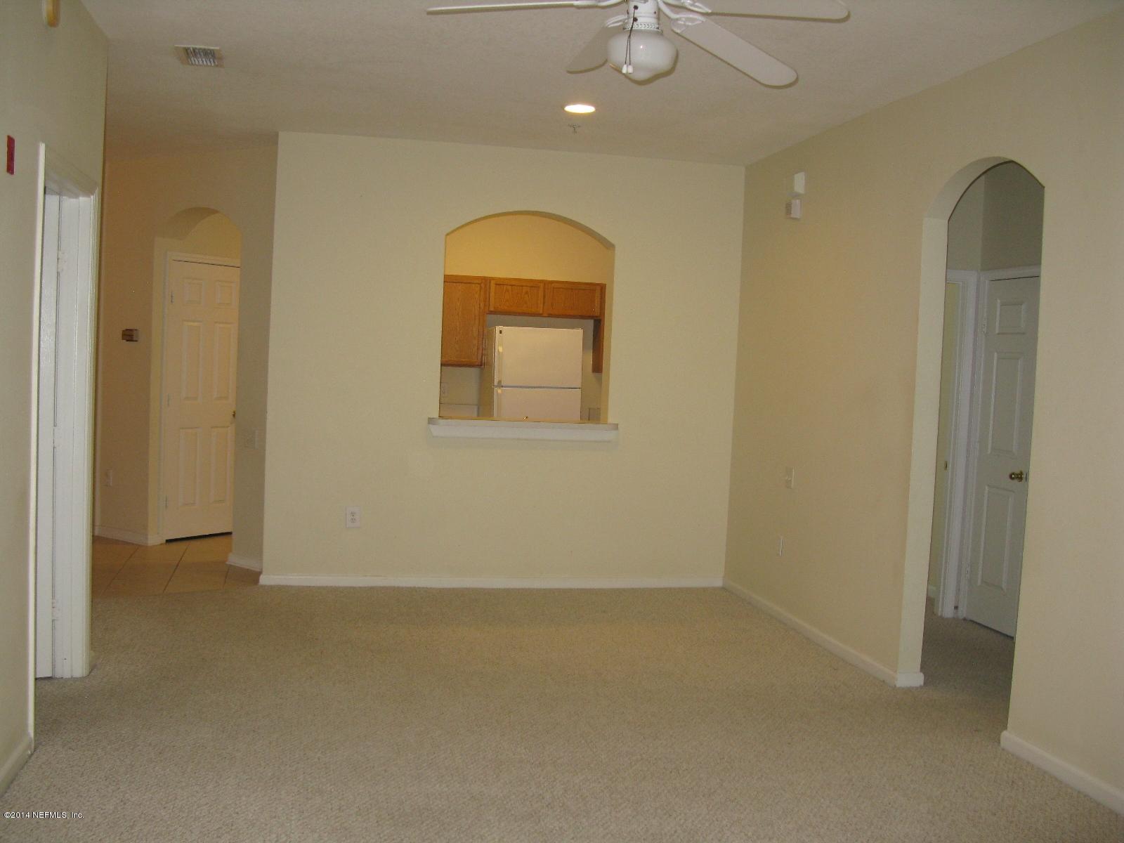 10550 Baymeadows Road, Unit 623 Jacksonville, FL 32256 - Photo 4 of 20 an empty room with a window and mirror