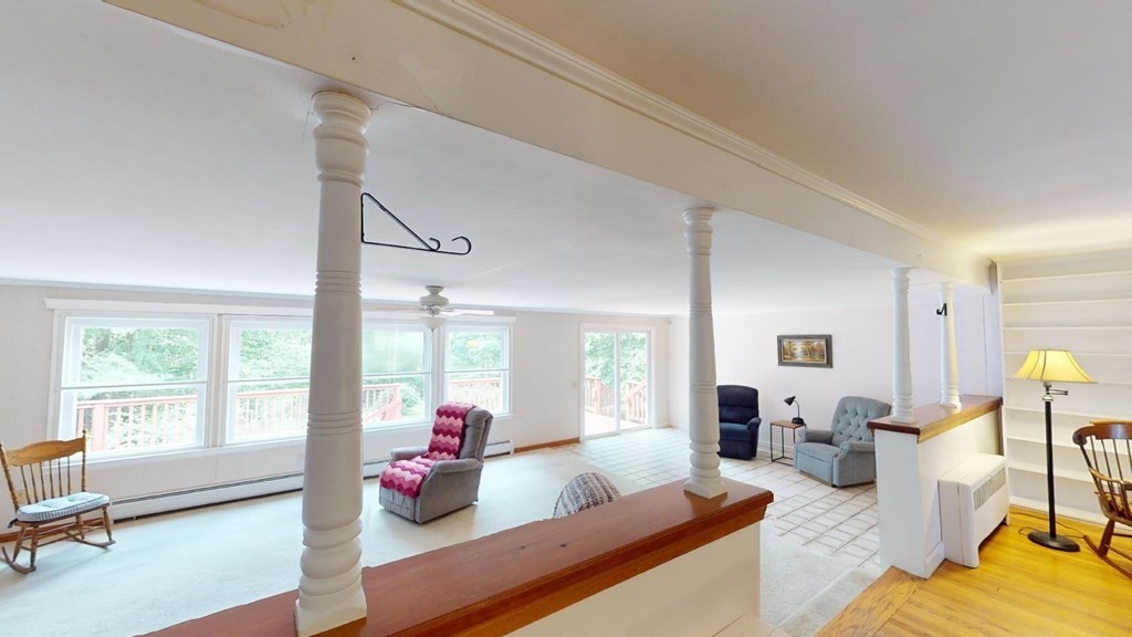 423 Florence Road Northampton, MA 01062 - Photo 11 of 32 a living room with furniture and a large window