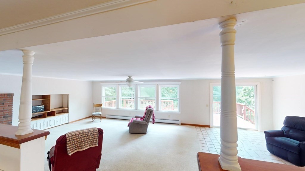 423 Florence Road Northampton, MA 01062 - Photo 9 of 32 a living room with furniture and a flat screen tv