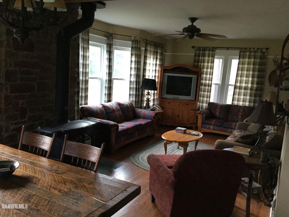 1027 South Apple River Road Elizabeth, IL 61028 - Photo 10 of 25 a living room with furniture and a fireplace