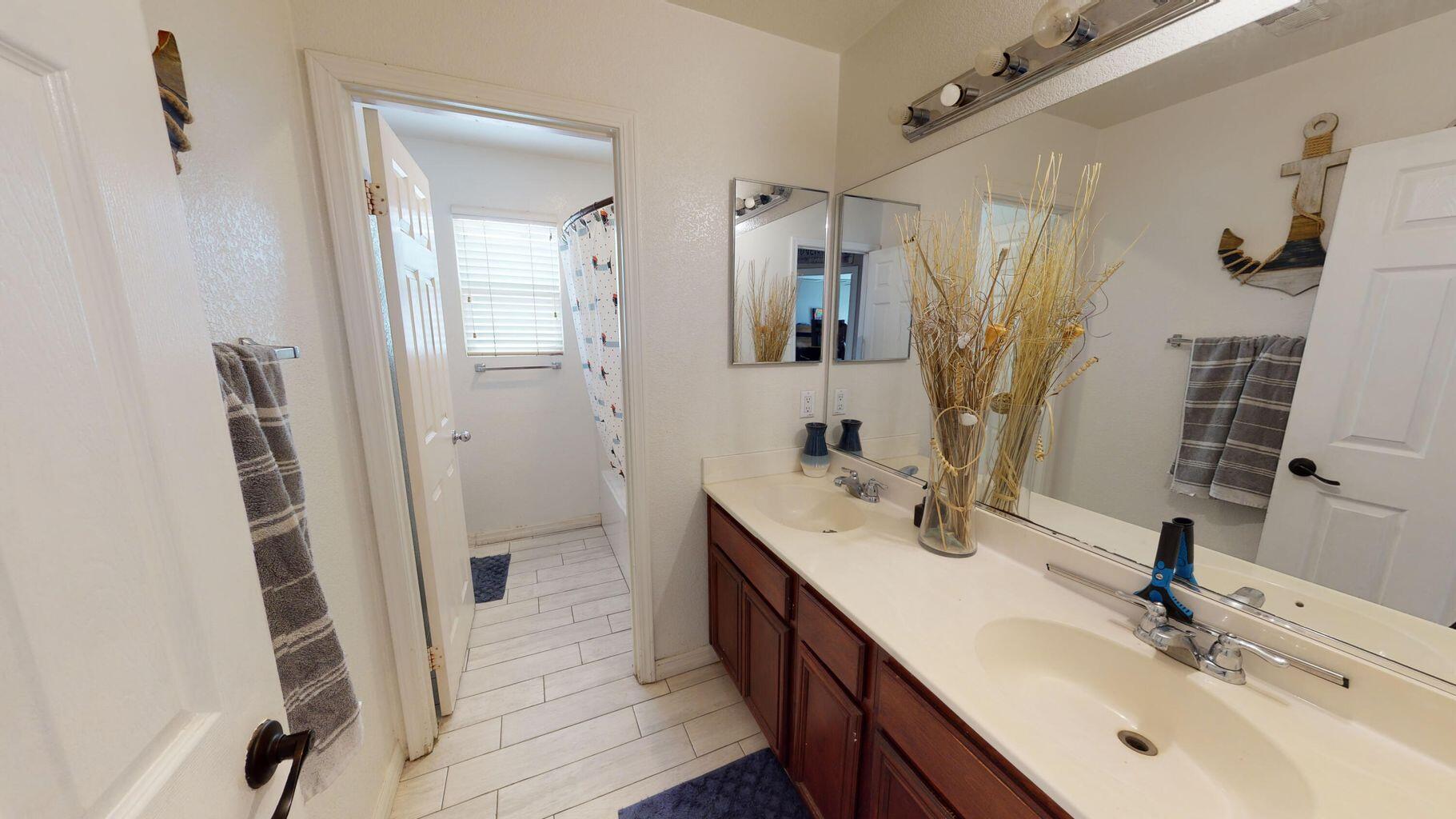 83680 Glendora Ridge Avenue Coachella, CA 92236 - Photo 14 of 32 a bathroom with double vanity sink and a mirror