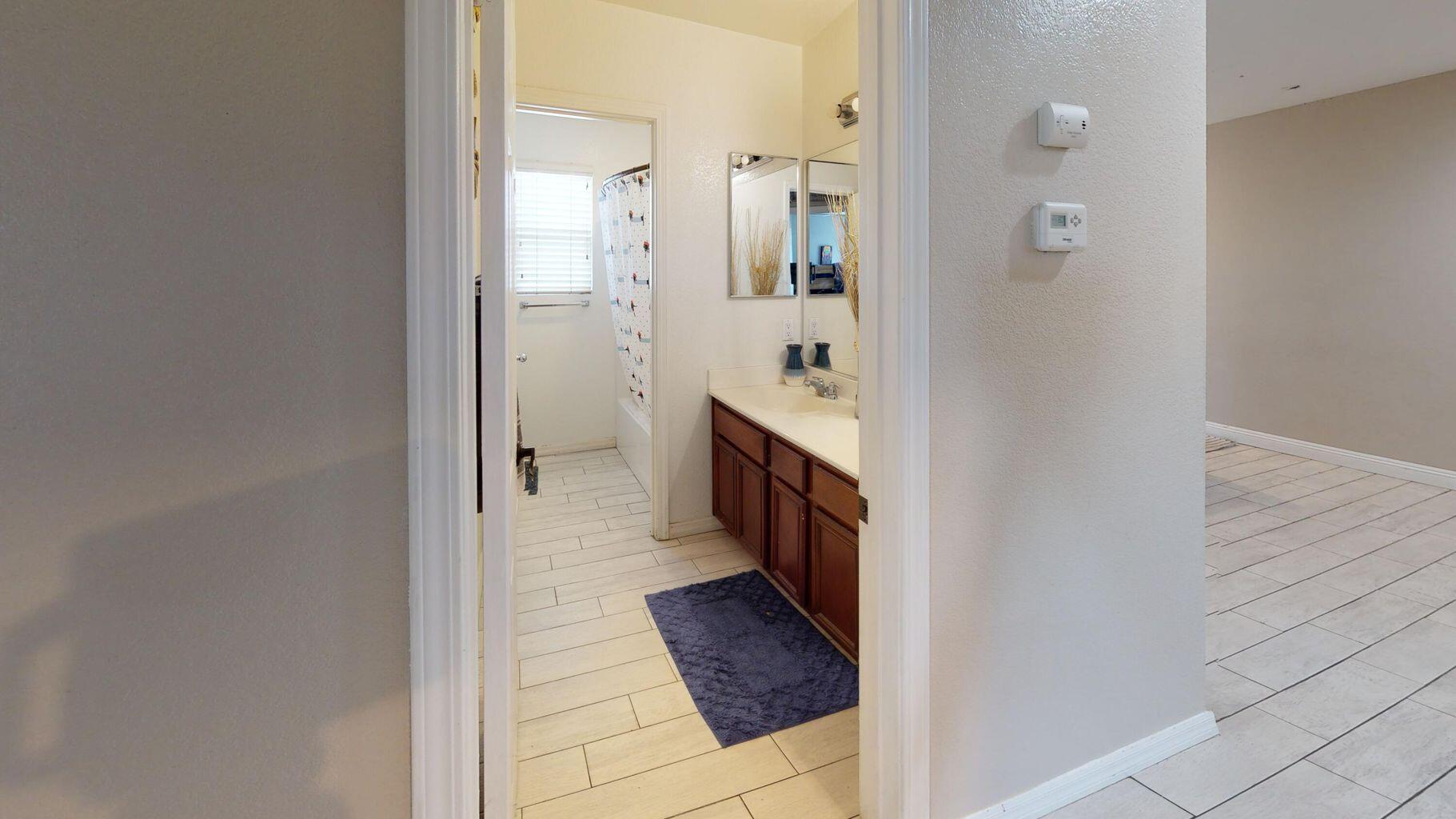 83680 Glendora Ridge Avenue Coachella, CA 92236 - Photo 15 of 32 a bathroom with a sink and a mirror