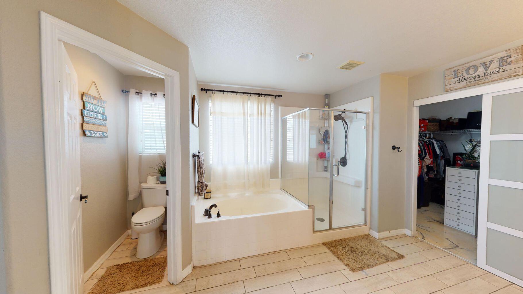 83680 Glendora Ridge Avenue Coachella, CA 92236 - Photo 19 of 32 a bathroom with a bathtub and a shower