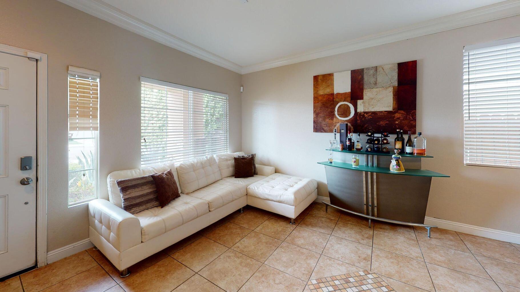 83680 Glendora Ridge Avenue Coachella, CA 92236 - Photo 2 of 32 a living room with furniture and a window