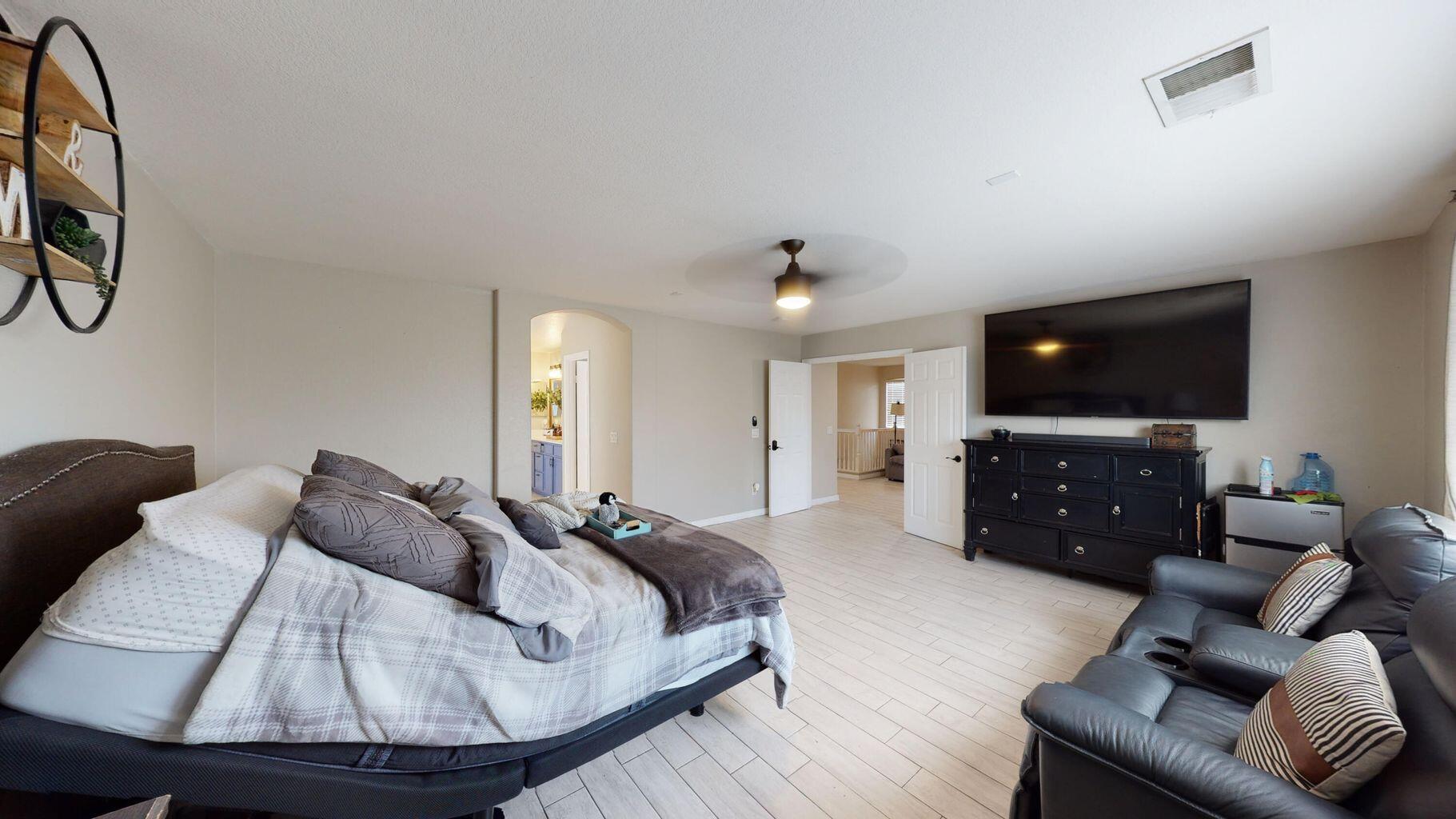 83680 Glendora Ridge Avenue Coachella, CA 92236 - Photo 22 of 32 a living room with furniture and a flat screen tv