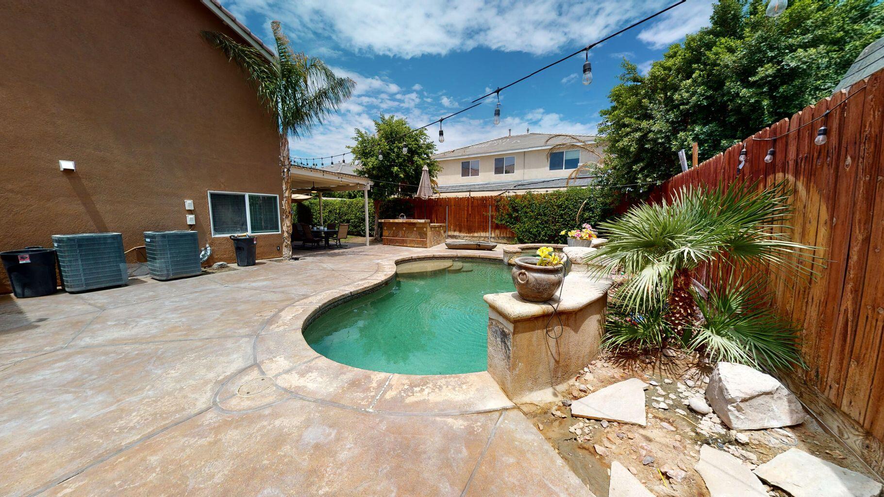 83680 Glendora Ridge Avenue Coachella, CA 92236 - Photo 31 of 32 a view of a backyard with plants and patio