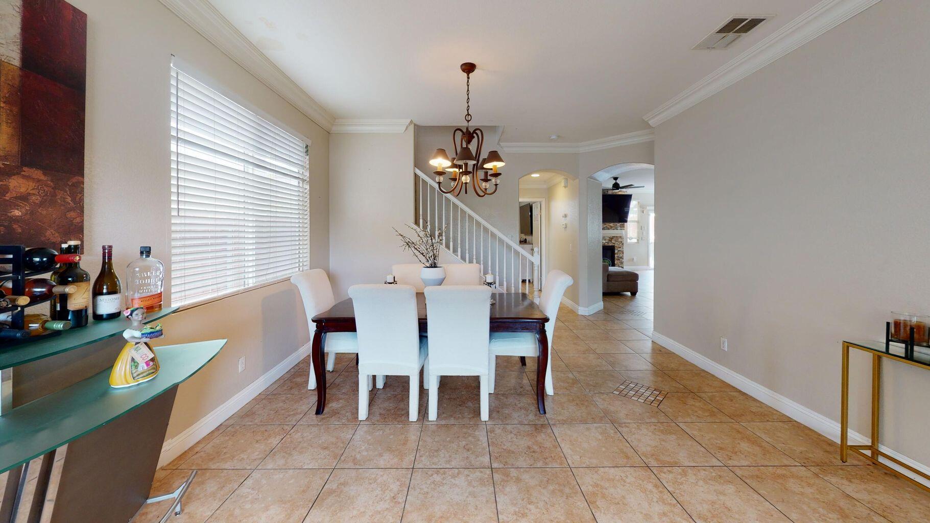 83680 Glendora Ridge Avenue Coachella, CA 92236 - Photo 4 of 32 a dining room with furniture and window