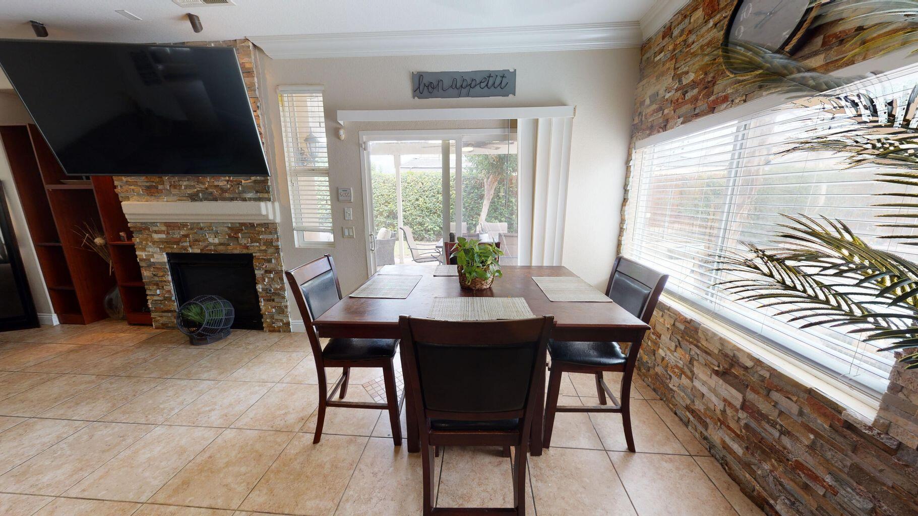 83680 Glendora Ridge Avenue Coachella, CA 92236 - Photo 7 of 32 a view of a dining room with furniture window and outside view