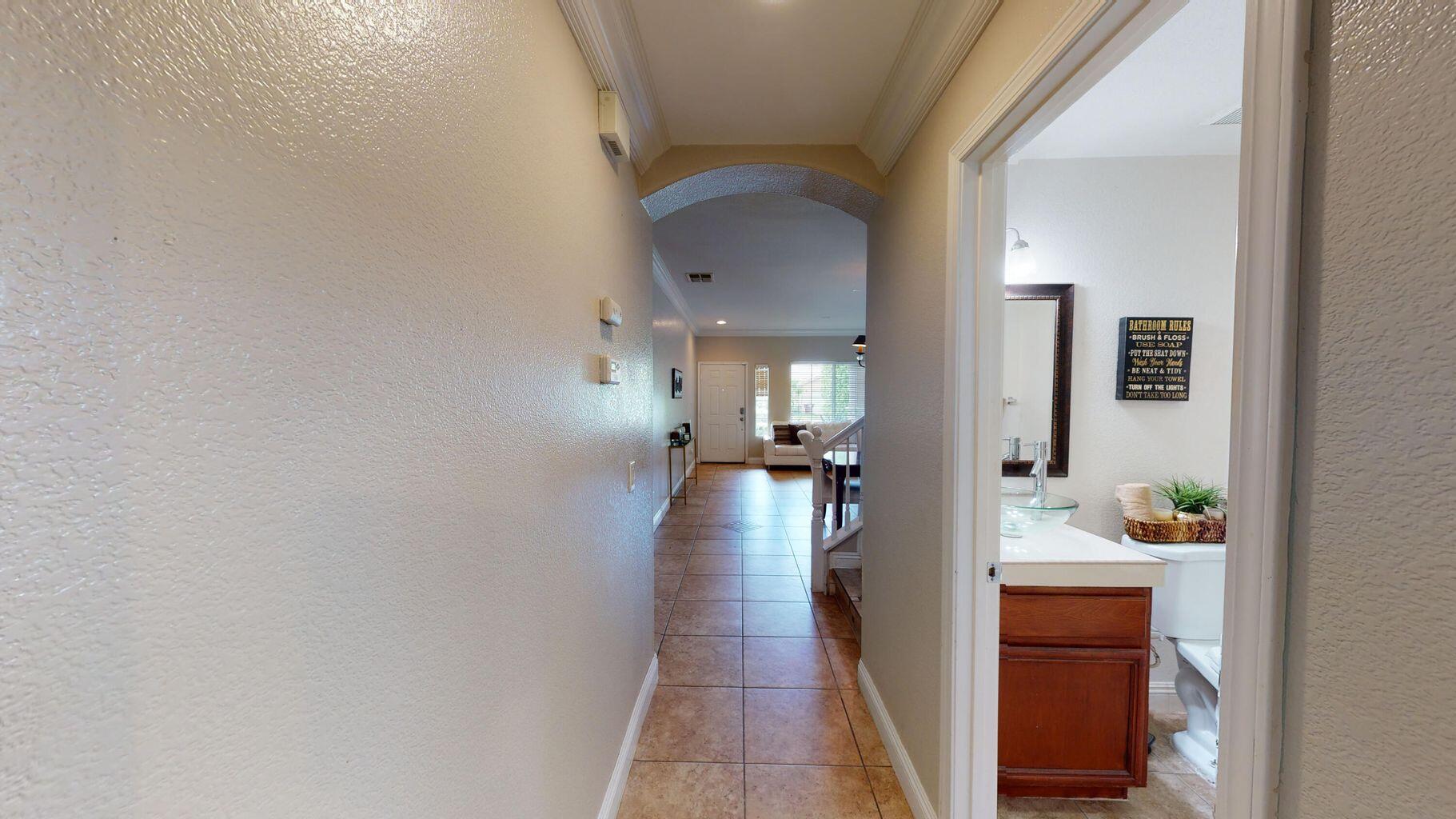 83680 Glendora Ridge Avenue Coachella, CA 92236 - Photo 9 of 32 a view of a living room and bathroom