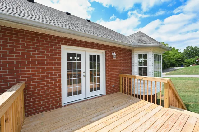a view of a house with a yard and sitting area