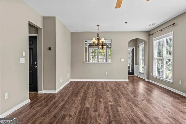 an empty room with closet and a bathroom