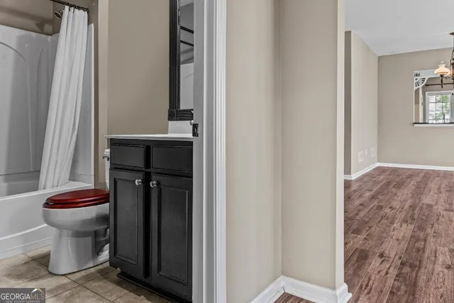 an aerial view of a house with garden space and street view